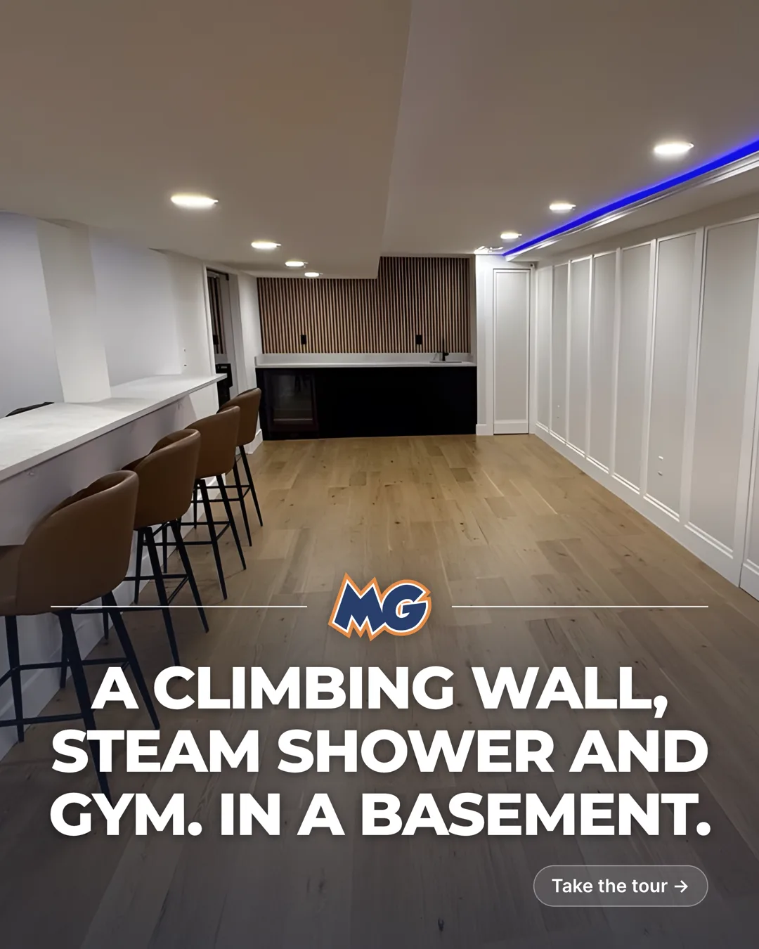 Finished basement by MG Builders with a bar, wet bar and paneled walls, titled: A climbing wall, steam shower and gym. In a basement.