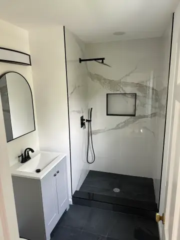 Basement bathroom with marble look shower