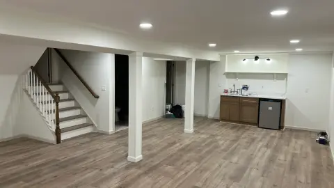 Finished basement stairs and kitchenette
