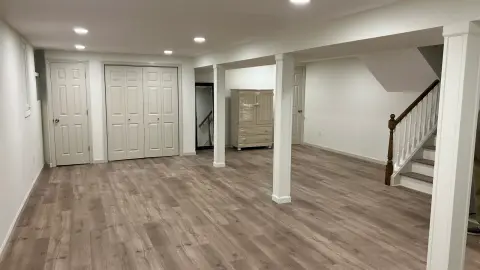 Finished basement with vinyl plank floor