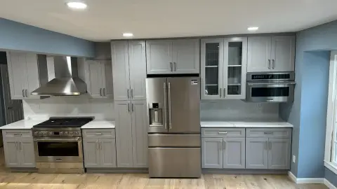 Gray shaker kitchen with stainless appliances