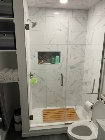 Marble look tile walk-in shower