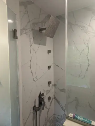 Marble tile shower with body sprays
