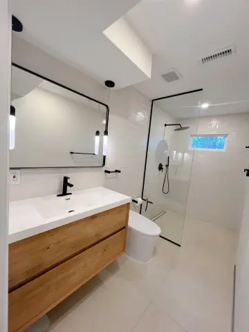Modern bathroom with floating vanity and glass shower