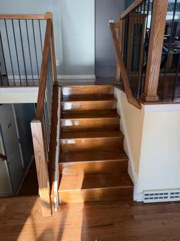 Refinished hardwood stairs with new railing