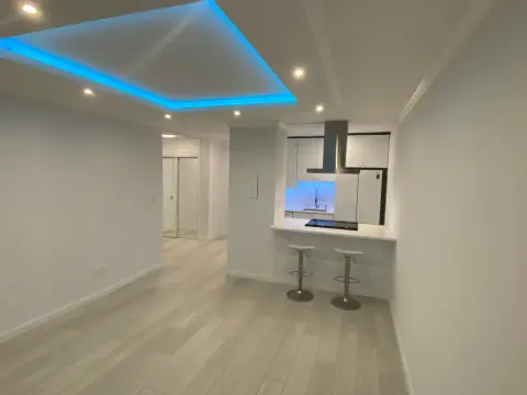 Remodel with cove lighting and breakfast bar